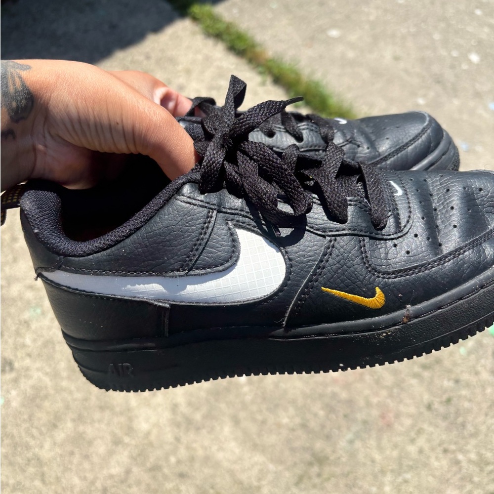 Nike Kids Black and White Sneakers with Gold Accent